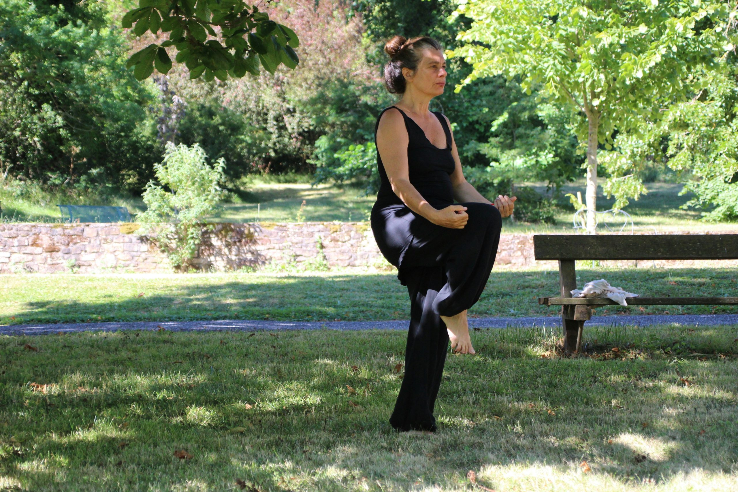 A person practicing deep breathing exercises outdoors.