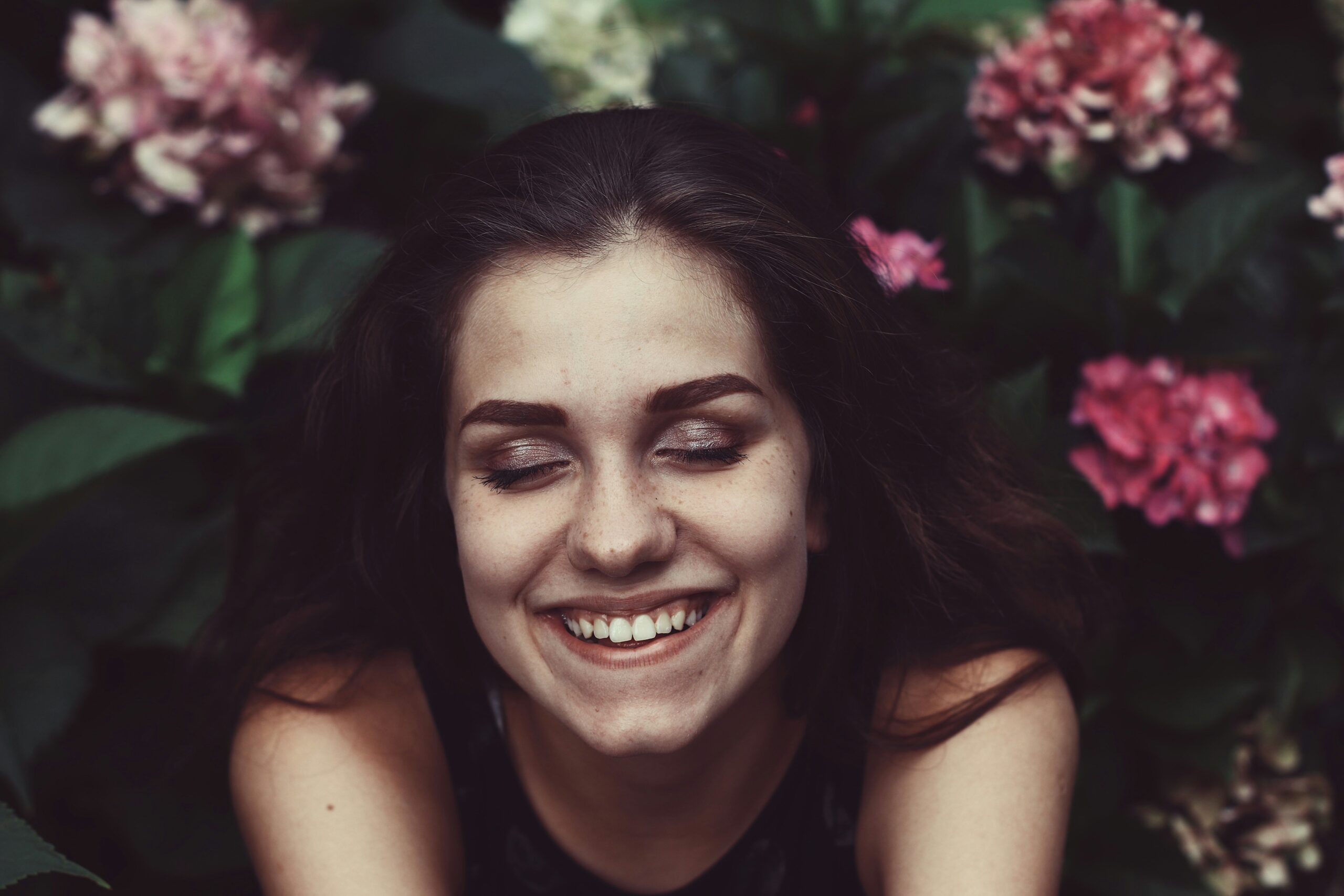 Before and after photo of Sarah smiling confidently
