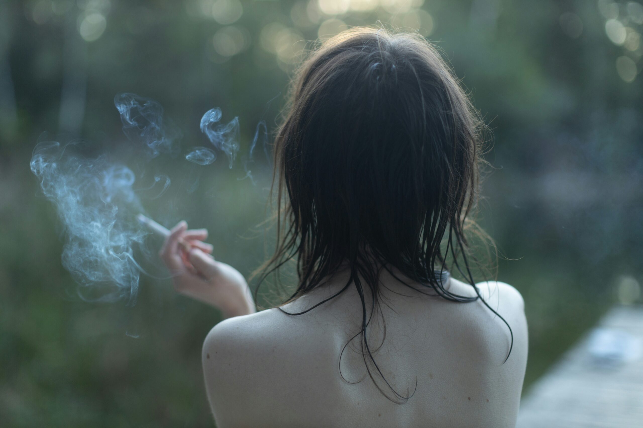 a woman with her hair blowing in the wind