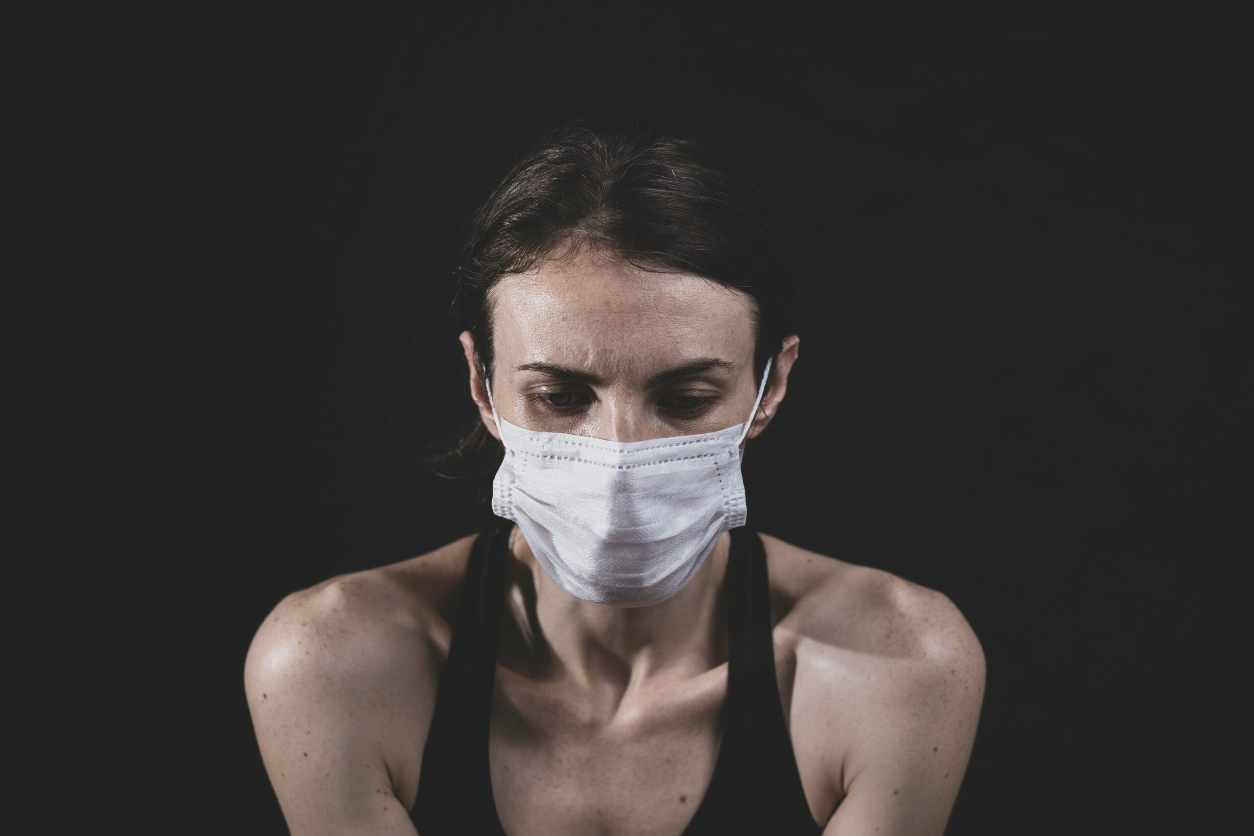young woman and coronavirus mask